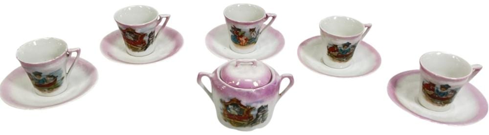 Five small porcelain cups with handles and matching saucers with pink and colorful transfer-style scenes, plus a small lidded pot in the center.