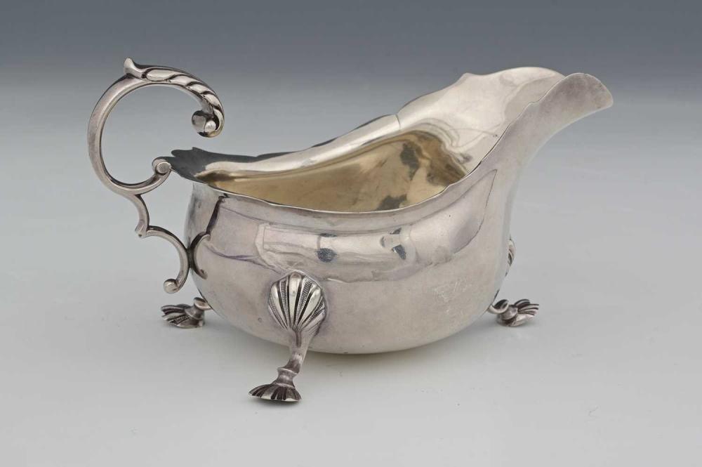 Henry Wambini comparable auction result: a george v silver sauce boat by henry w