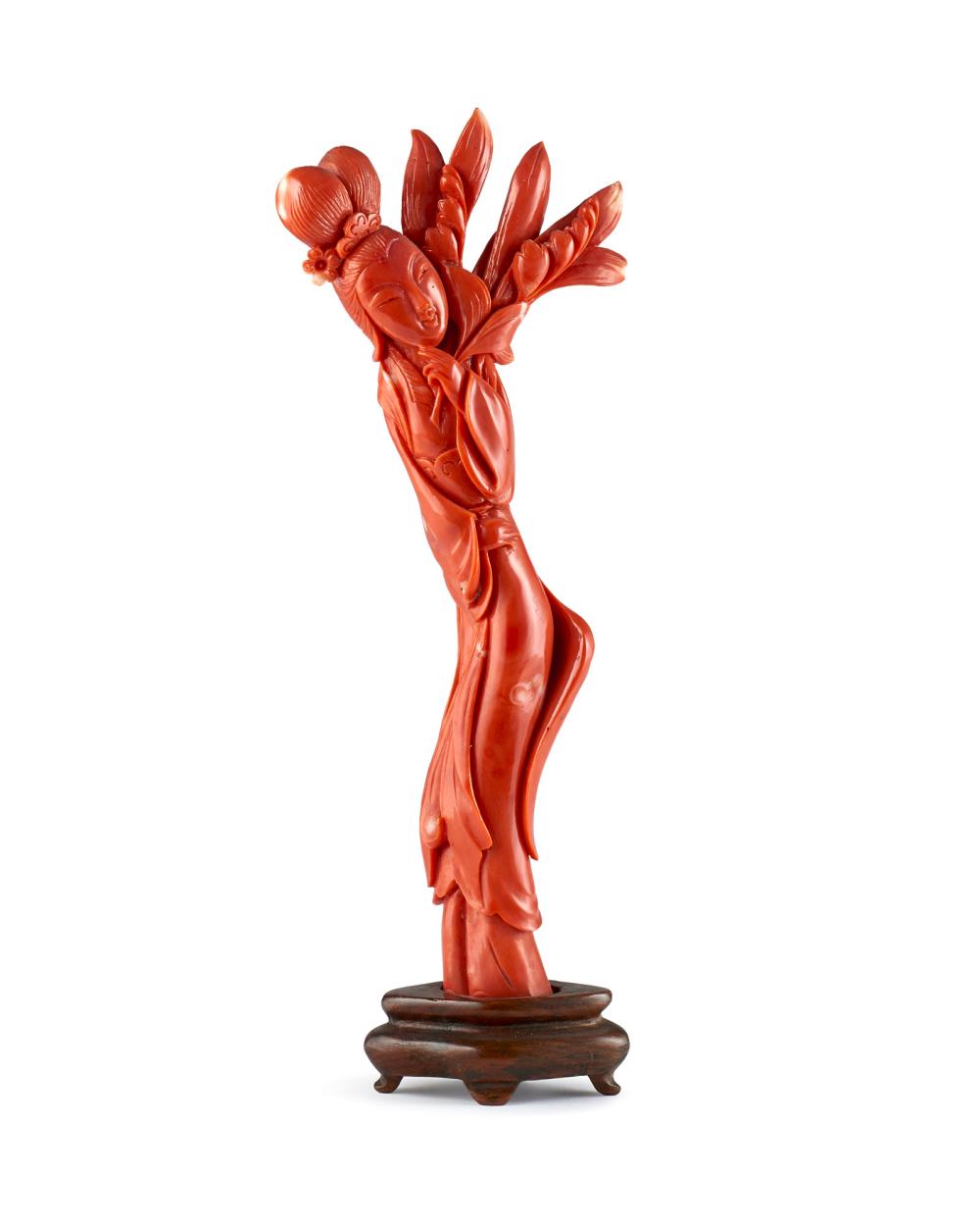 Coral carving depicting Guanyin wearing a long robe and holding leafy branches China, Qing dynasty (1644-1911), late 19th century (gross weight 170 g) (h. 17.5 cm) mounted on a wooden stand (defects) This lot is accompanied by an expert... sold by Il Ponte Auction House, lot 176 — auction record photograph