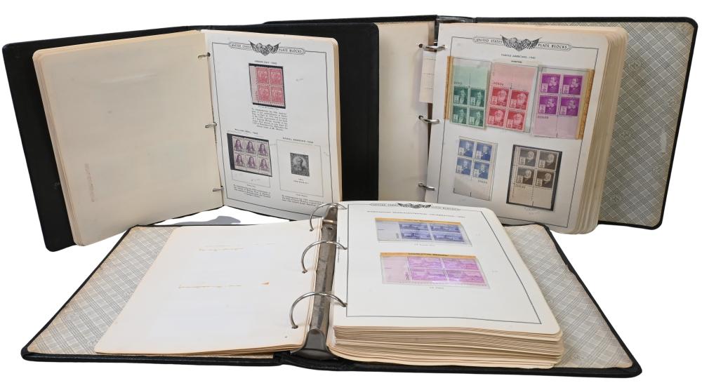 Three-ring stamp album open to pages showing rows of U.S. postage stamp plate blocks and printed album sheets.