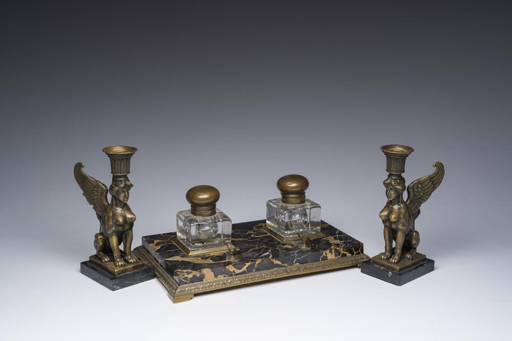 Miguel Fernando Lopez comparable auction result: milo 1955 a pair of bronze retour d egypte candlesticks and a bronze mounted marble ink stand 19th 20th c