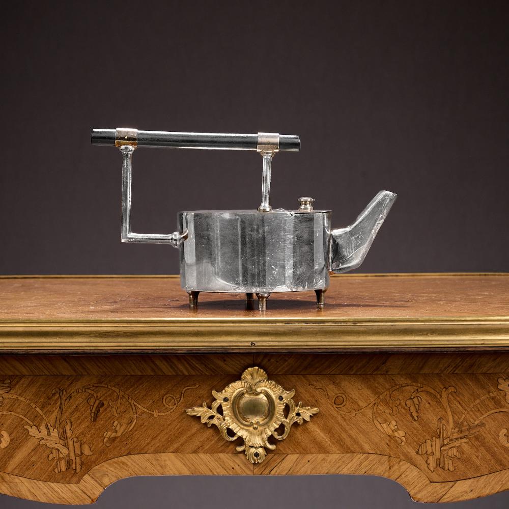 Christopher Dresser comparable auction result: a silver plated teapot after the design by christopher dresser
