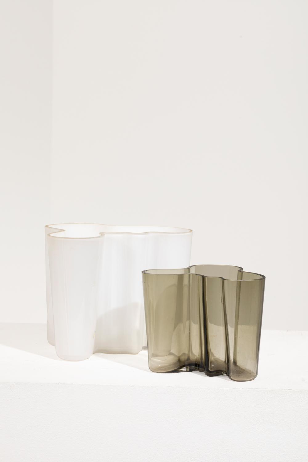 Alvar Aalto comparable auction result: alvar aalto 1898 1976 suite de deux vases de forme libre en verre fum et opalin blanc