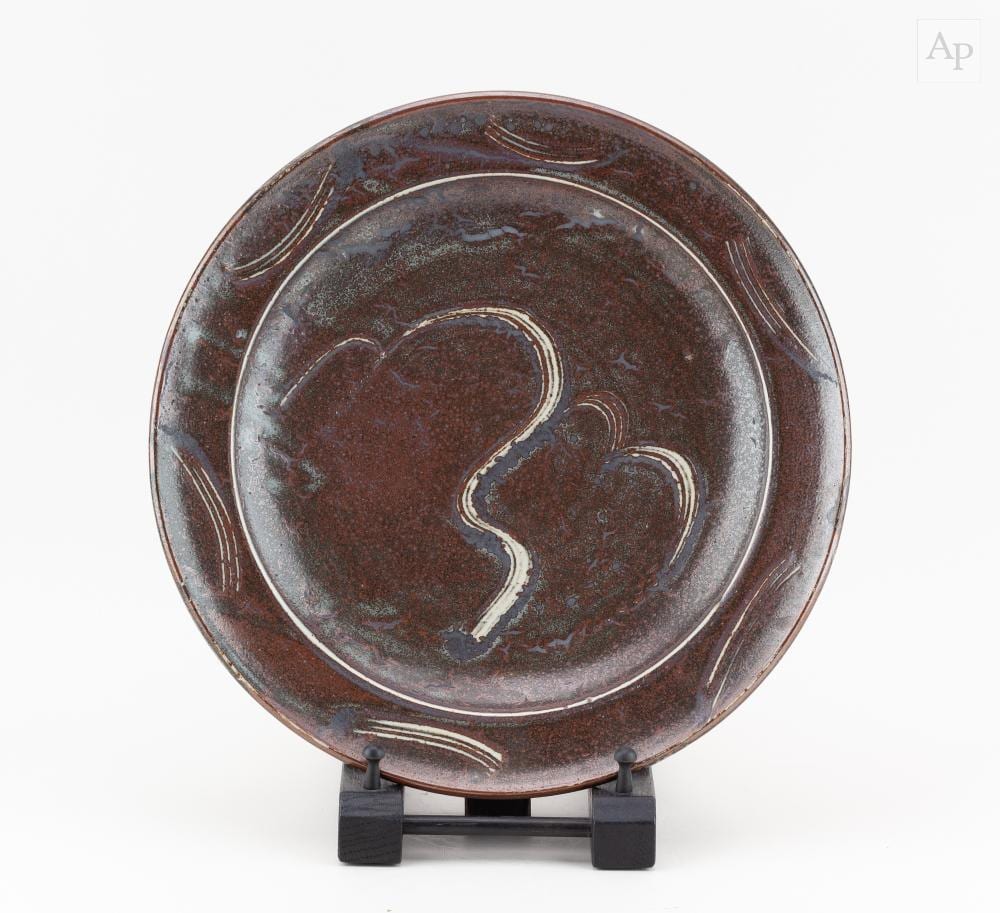 David Leach comparable auction result: david leach 1911 2005 for lowerdown pottery a stoneware charger covered in tenmoku breaking to kaki glaze with a willow tree motif impressed dl mark diameter 34cm