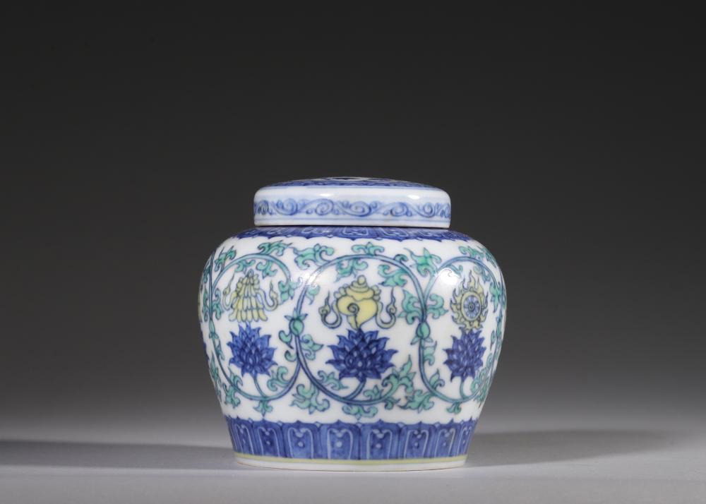 A DOUCAI COVERED JAR WITH INTERLOCKING LOTUS AND EIGHT BUDDHIST TREASURES MOTIFS, CHENGHUA PERIOD, MING DYNASTY sold by Hotspot Auctions, lot 408 — auction record photograph