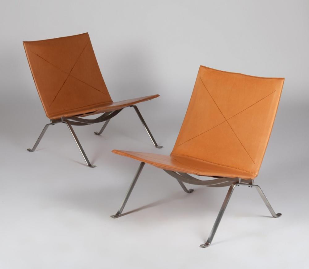 Poul Kjærholm comparable auction result: poul kj rholm denmark 1929 1980 designed in 1956 a pair of pk 22 chairs in satin brushed spring steel frame upholstered in cognac leather some signs of wear