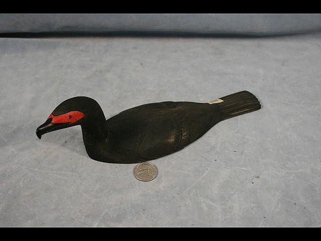 Larry Mayac comparable auction result: 11 white ivory red faced comorant by larry mayac