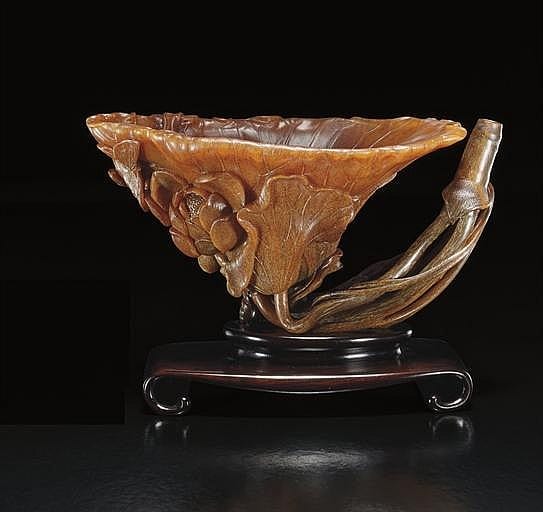 A Rare And Exquisitely Carved Rhinoceros HORN LOTUS-LEAF SHAPED WATERDROPPER comparable sale