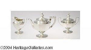 [ SILVER ] A THREE PIECE AMERICAN SILVER OCTAGONAL TEA SERVICE (Mark of Gorham, Providence, Rhode Island) Mark of Gorham, Providence, Rhode Island, c.1910 Parcel gilt, octagonal shape, urn shaped finials and ivory insulators, a period Old English 'G' sold by Heritage Auctions, lot 18278 — auction record photograph