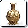 Small bronze vase with bulbous body, decorative ridges, and a flared neck and rim.