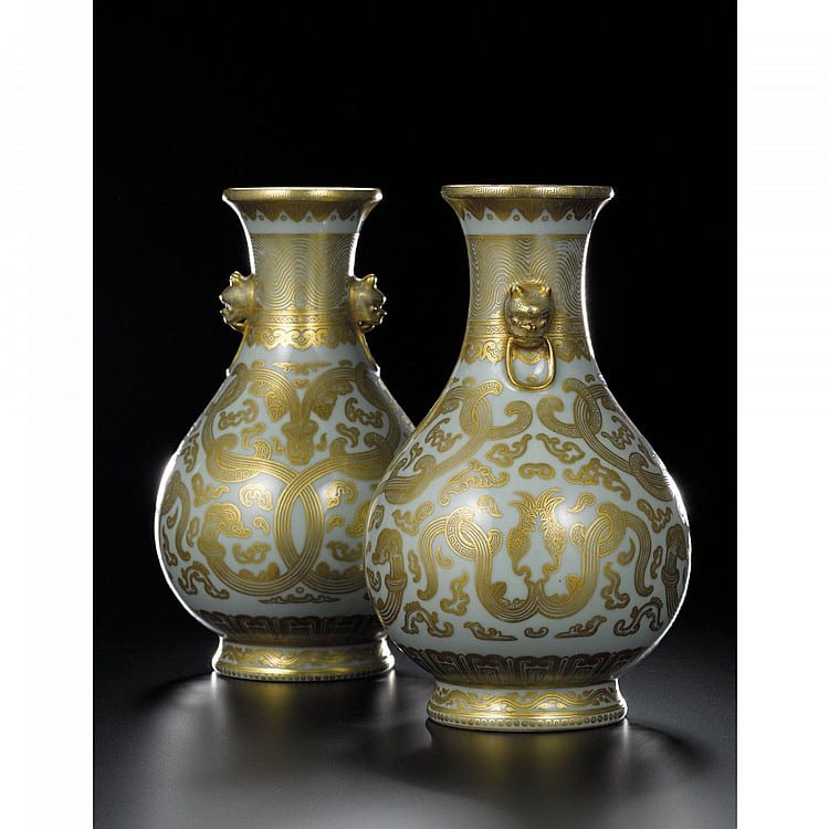 A Fine And Very Rare Pair OF ARCHAISTIC CELADON-GROUND GILT-DECORATED VASES SEAL MARKS AND PERIOD OF QIANLONG comparable sale
