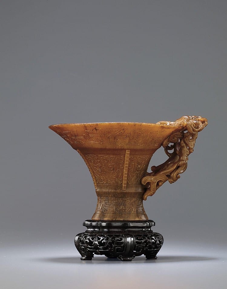 A Finely Carved 'MYTHICAL BEAST' RHINOCEROS HORN LIBATION CUP comparable sale