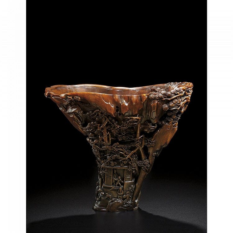A RARE AND EXCEPTIONALLY CARVED RHINOCEROS HORN LIBATION CUP, BY Bao Tiancheng 17th Century comparable sale