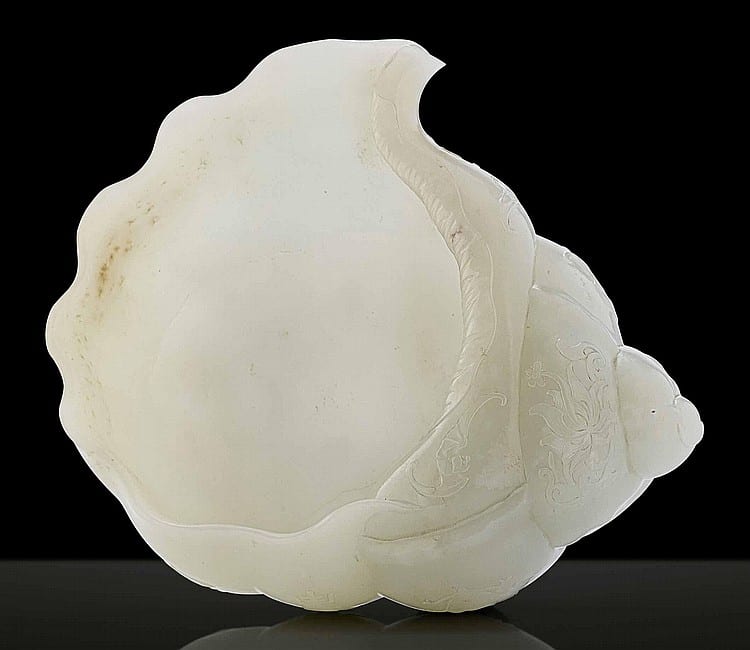 An Important Imperial Large White Jade CARVING OF A CONCH SHELL comparable sale