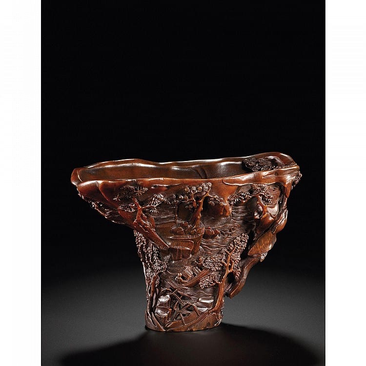 A Rare And Exceptionally Carved Rhinoceros Horn Libation Cup, BY XING CHENG MING DYNASTY, DATED TO 1639 comparable sale