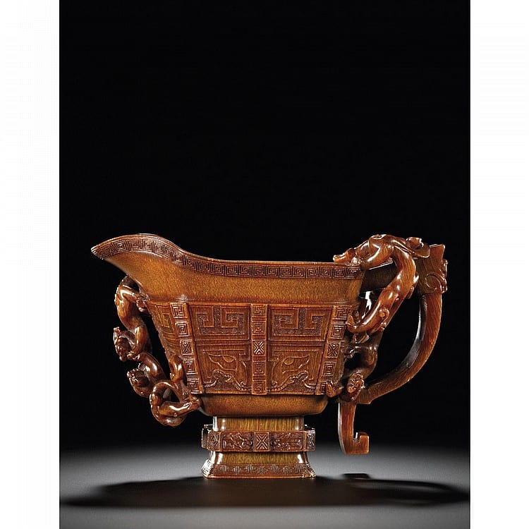 AN EXTREMELY RARE LARGE RHINOCEROS HORN ARCHAISTIC GUANG VESSEL BY You Yiliang 17th Century comparable sale