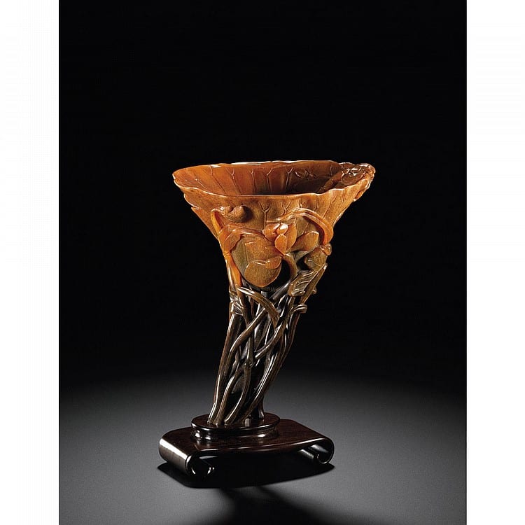 A Reticulated Stem 'LOTUS LEAF' RHINOCEROS HORN LIBATION CUP 17TH CENTURY comparable sale