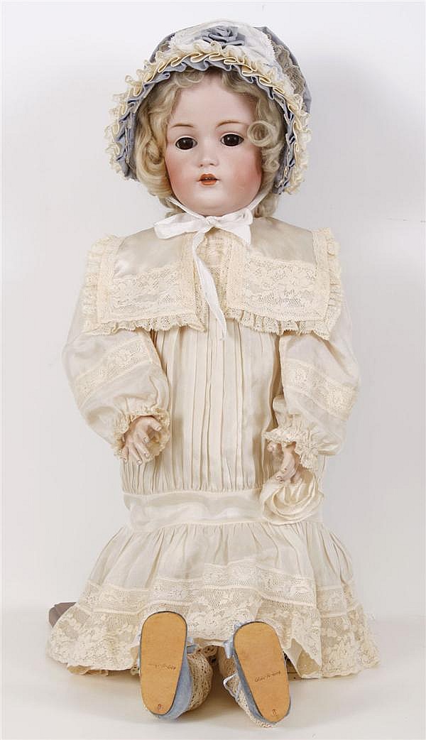26" GERMAN KESTNER BISQUE HEAD DOLL - Bisque socket head with brown glass sleep eyes; composition ball jointed body. Pale blond anti... sold by Pacific Galleries, lot 59 — auction record photograph