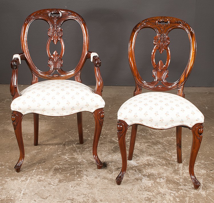 Set of eight Sheraton style mahogany dining chairs with oval shaped carved backs and cabriole legs, armchairs-23" wide, 18" deep, 37" high; side chairs-19" wide, 17" deep, 37" high sold by Northgate Gallery Auctions, lot 348 — auction record photograph
