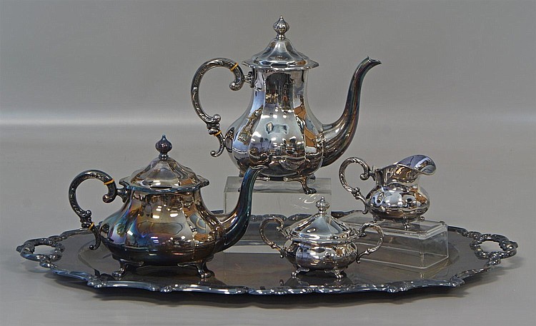 Auction comp thumbnail for 4 pc Eugen Ferner sterling silver tea set with a silver plated platter, Sterling set comprised of a tea pot, coffee pot, sugar and c... (William Bunch Auctions & Appraisals, Lot 12438)