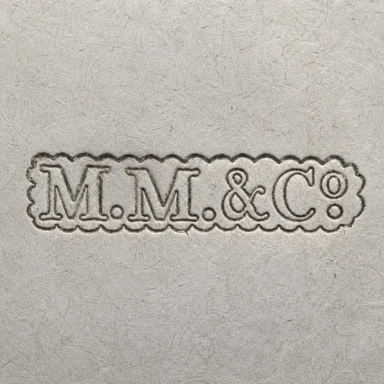 Marcus Merriman & Co.: M.M.&Co; oxidized reconstruction.