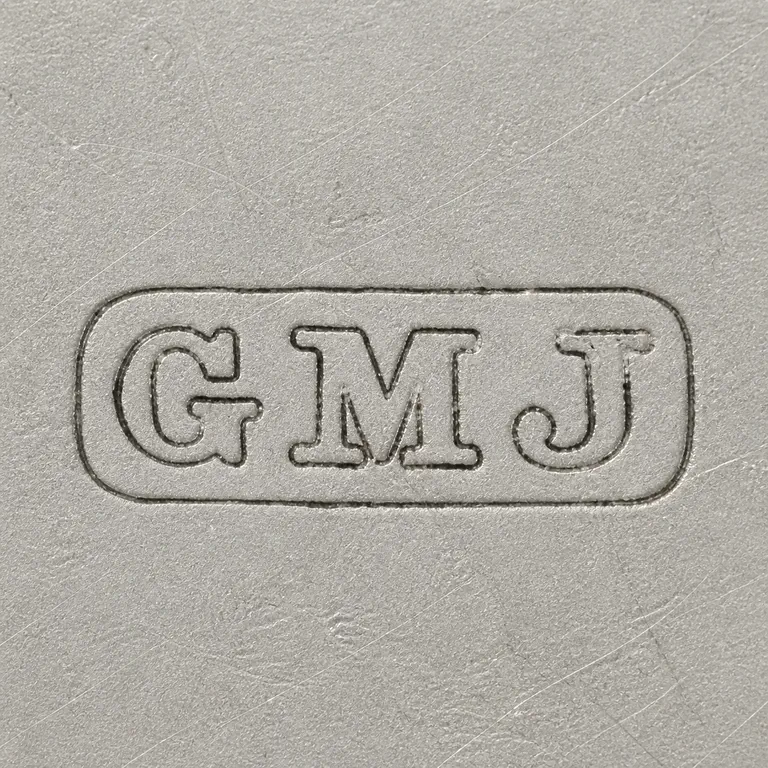 Josiah Williams & Co (George Maudsley Jackson): Unfilled irregular rectangular plaque with G-M-J sequence and left-to-right arrangement; oxidized reconstruction.