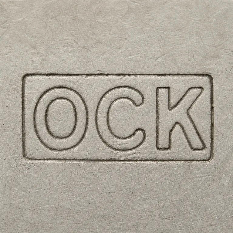 O.A.: Reconstruction preserves uppercase OCK inside one rectangular cartouche; oxidized reconstruction.