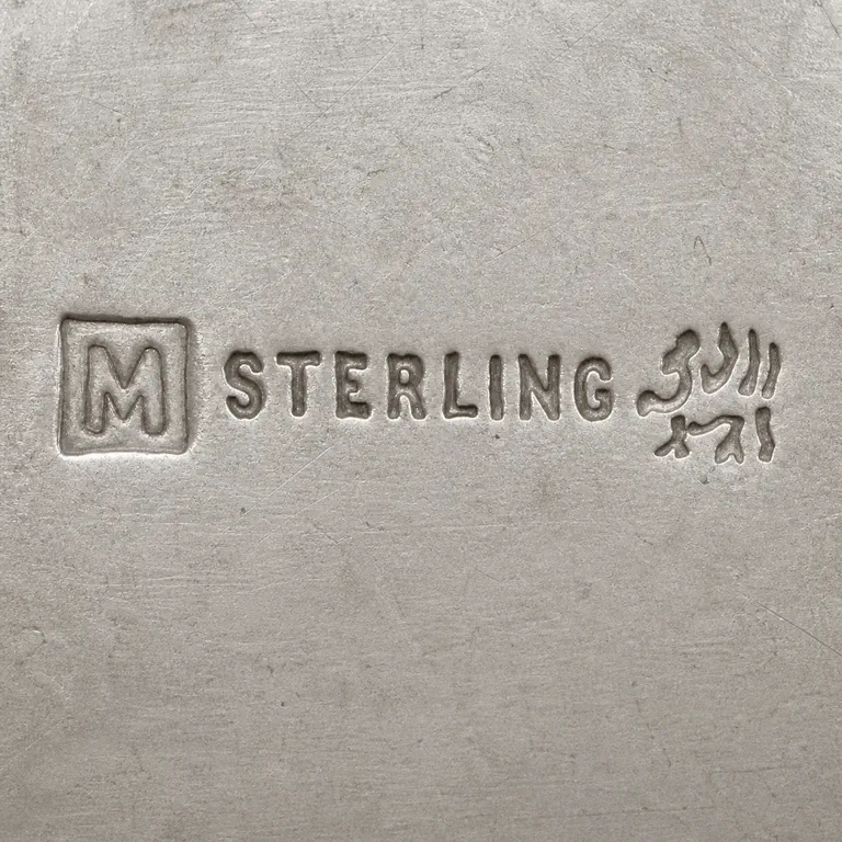 Maltby, Stevens & Curtiss Co.: Three open-space groups: boxed M, exact STERLING, and a compact worn ornamental group of upper points, curls, and lower forked fragments; oxidized reconstruction.