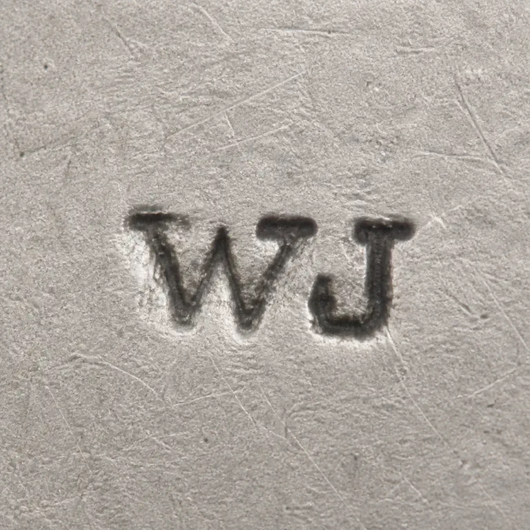William Jasper: Unenclosed W-like and J-like forms left-to-right with source spacing and orientation; oxidized reconstruction.