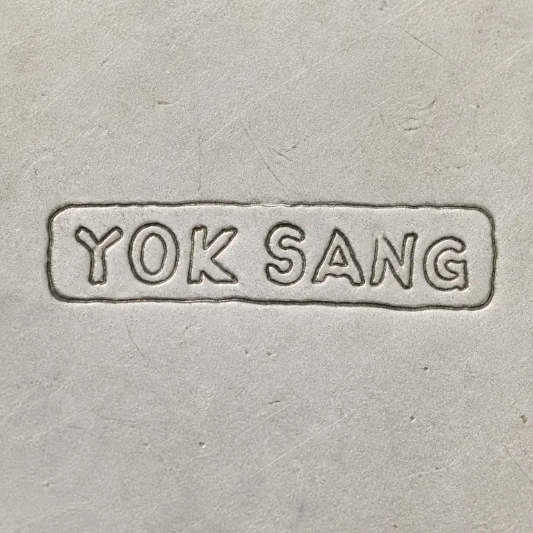 SILVERSMITH: One rounded rectangular cartouche contains exact uppercase YOK SANG in source order and orientation; oxidized reconstruction.