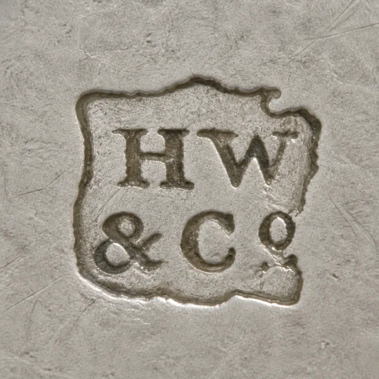 Henry Wilkinson & Co: Stacked HW and &CO arrangement inside the supported boundary; oxidized reconstruction.