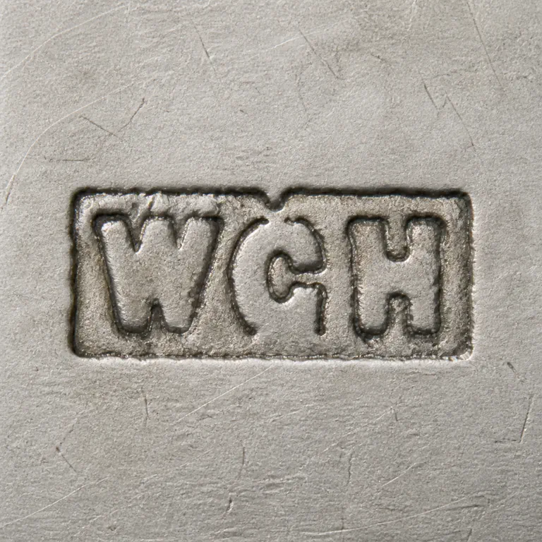 William George Hammon: W G H arranged left to right inside one worn rectangular cartouche, with a small central separator detail retained; oxidized reconstruction.