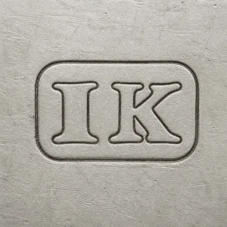 John Kidder: Clean redraw preserves the I K sequence and rounded rectangular punch; oxidized reconstruction.