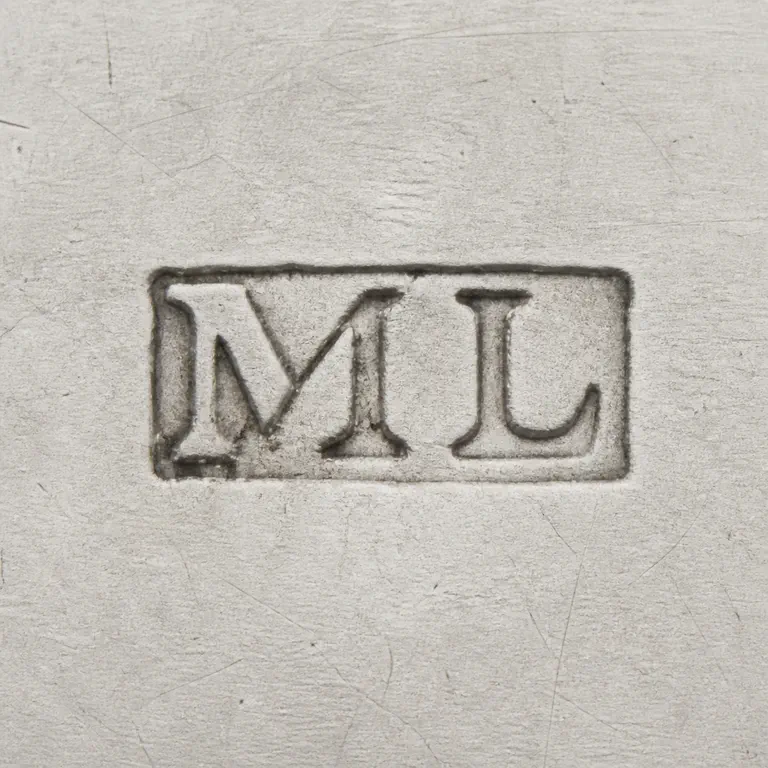 Matthew Linwood: A clear rectangular punch with supported M and L forms is reconstructed border; oxidized reconstruction.