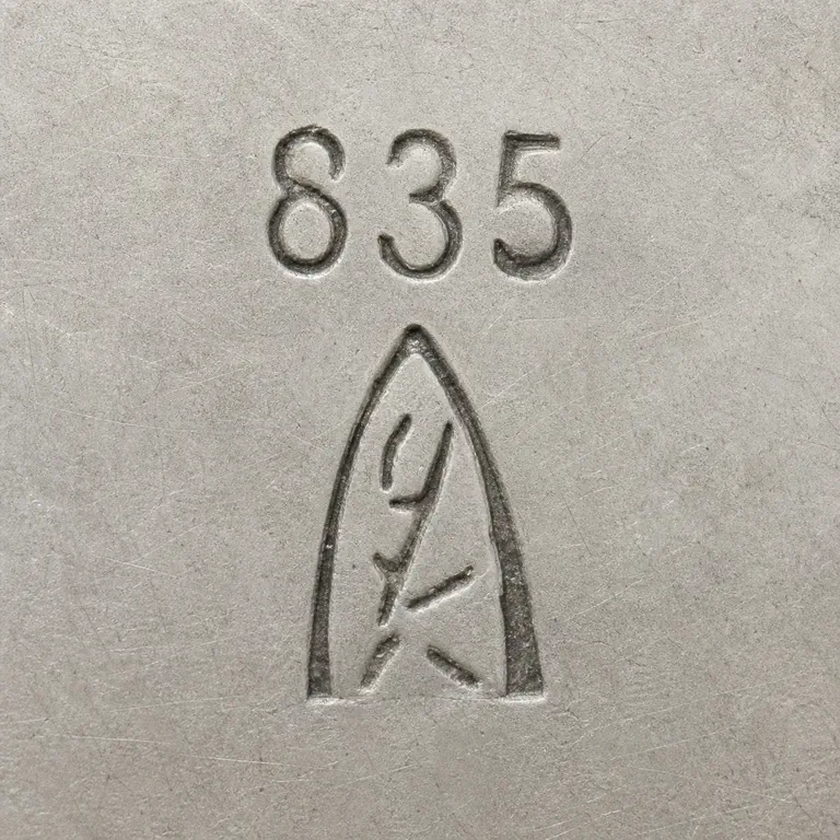 Richard Köberlin: Exact 835 above one pointed triangular punch containing disconnected worn vertical, curved, and diagonal fragments; oxidized reconstruction.