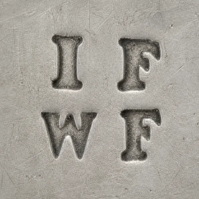 John & William Frost: Second render preserves the compact four-position I/F over W/F arrangement with relative spacing and no unsupported outer plaque or badge; oxidized reconstruction.