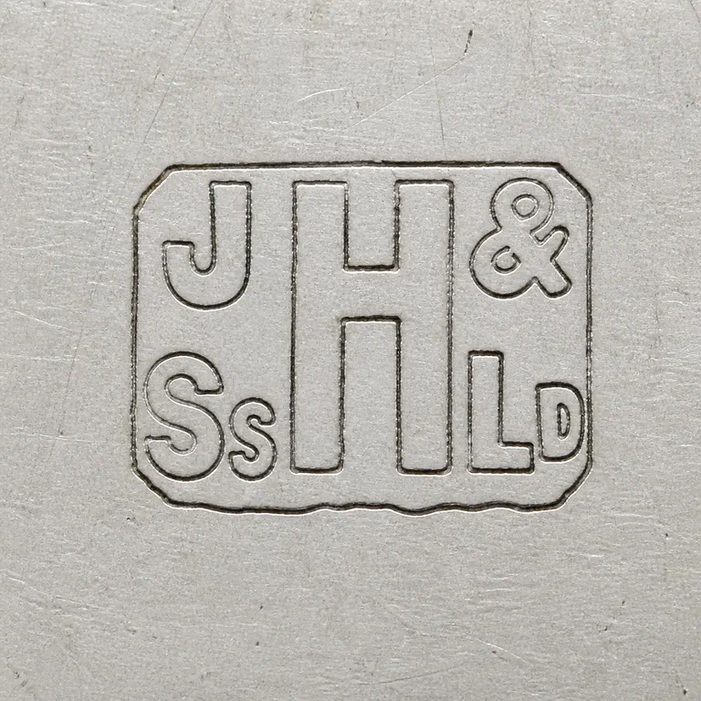 John Harvey & Sons Ltd: Two-line structure inside one compact worn rectangular cartouche: upper J H with ampersand-like terminal detail, lower S S followed by an…; oxidized reconstruction.