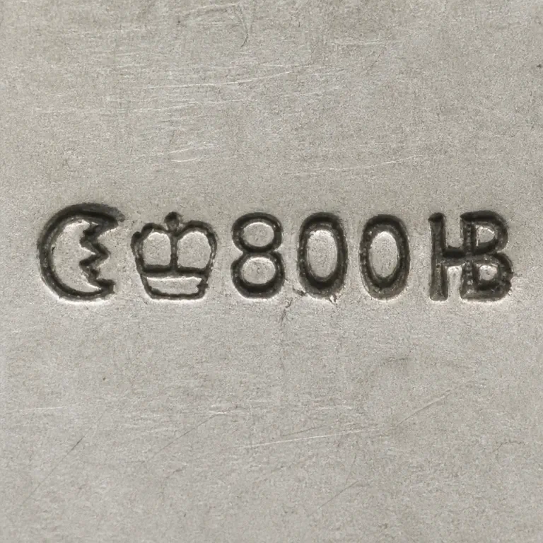 Robert Altermann: Crescent, crown, 800, and compact HB monogram in source order; oxidized reconstruction.