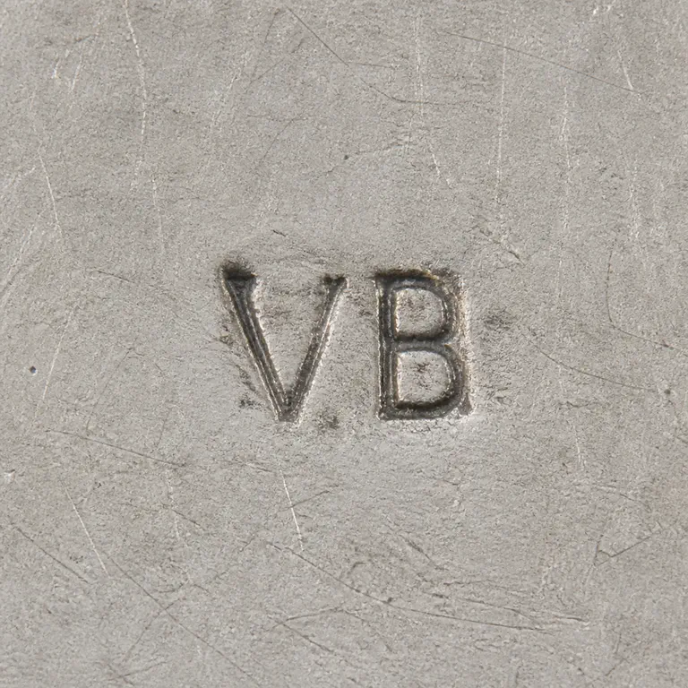 VA: VB in two thin upright capitals with tight spacing and no added cartouche; oxidized reconstruction.