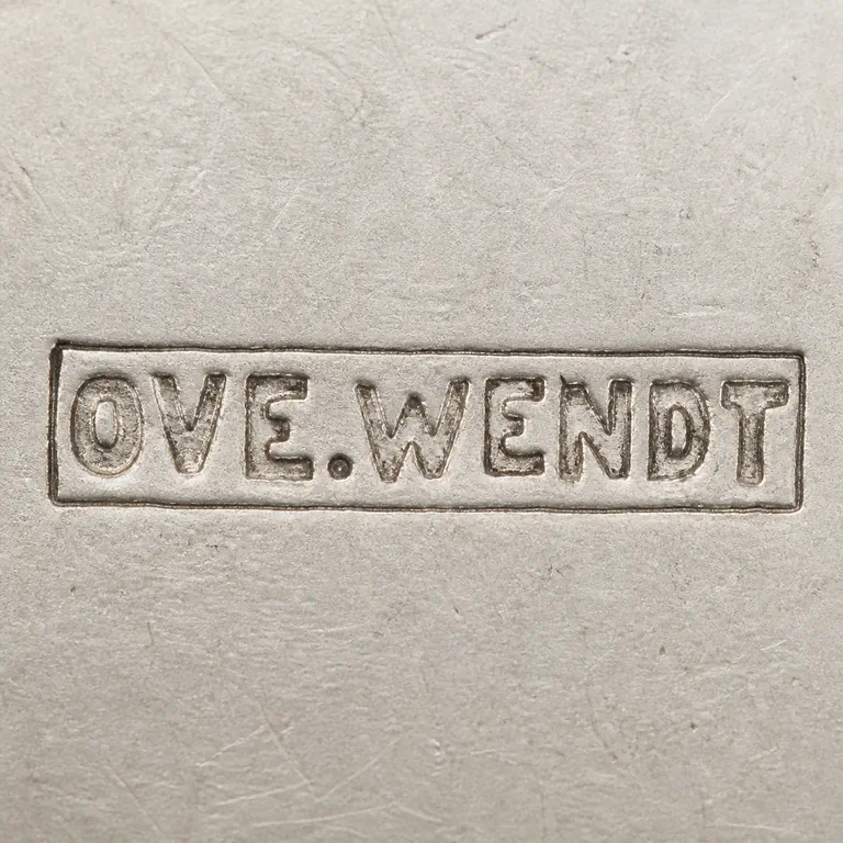 O.A.: Reconstruction preserves uppercase OVE.WENDT, one period after E, and one rectangular cartouche; oxidized reconstruction.