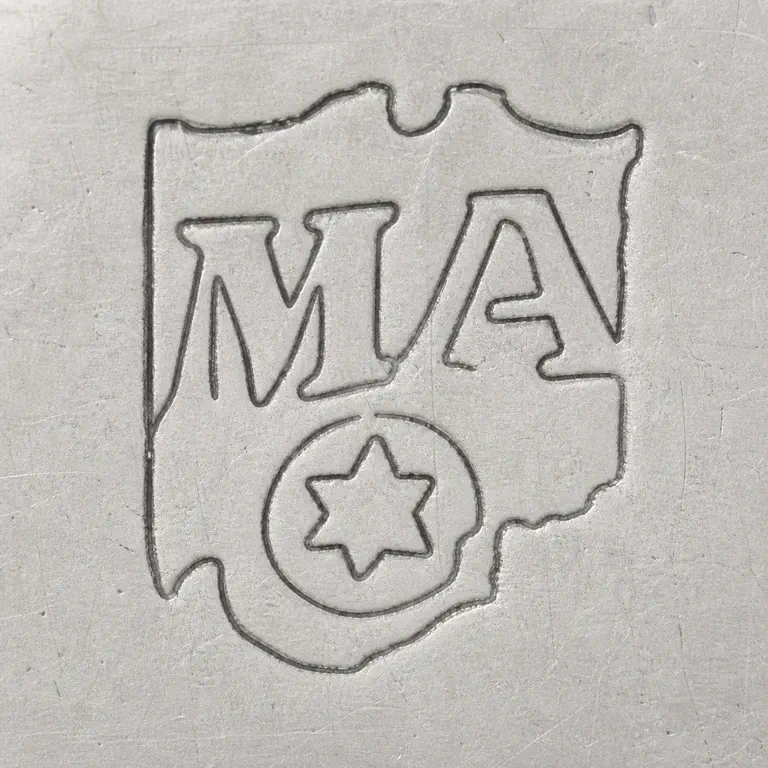 Thomas Mann: Worn shield-like mark with M/A-like upper forms and a lower circular star-like device; oxidized reconstruction.