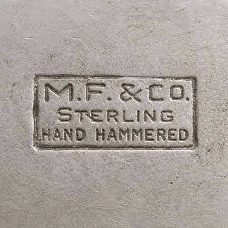 Marshall Field: M.F. & Co, Hand Hammered; oxidized reconstruction.