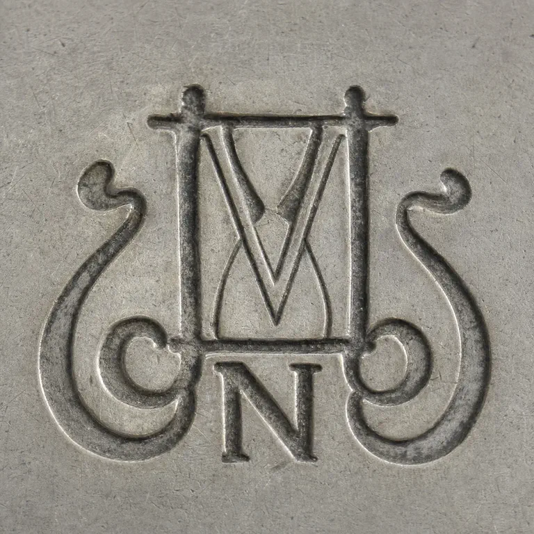 Nevius Company: N, hourglass; oxidized reconstruction.