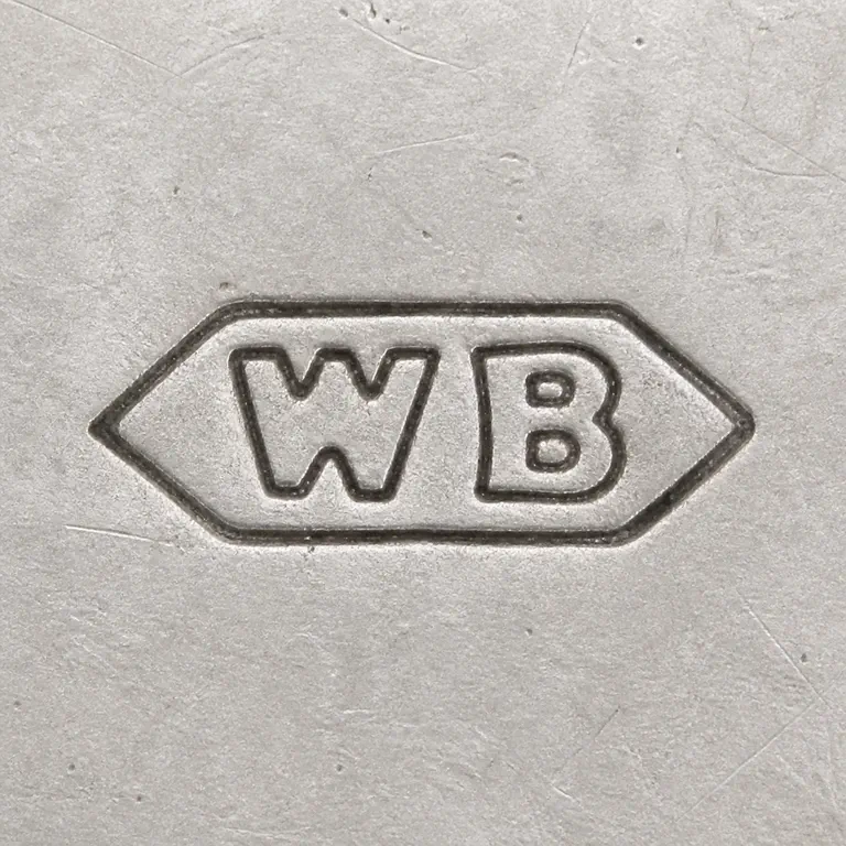 W B: W B arranged left to right inside one compact pointed-ended cartouche, with no unsupported interior marks; oxidized reconstruction.
