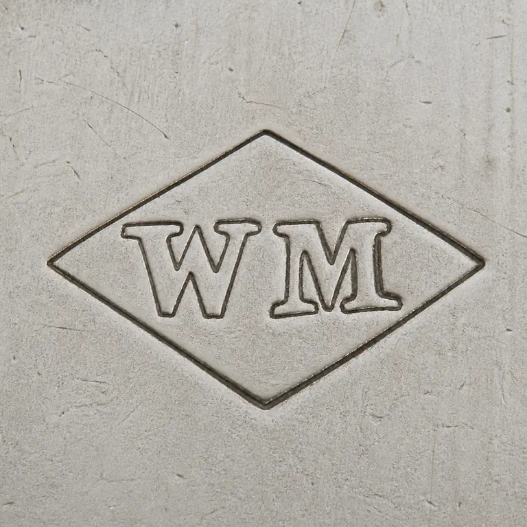 William Moering: The W then M arrangement and horizontally oriented diamond/rhombus cartouche The and; oxidized reconstruction.