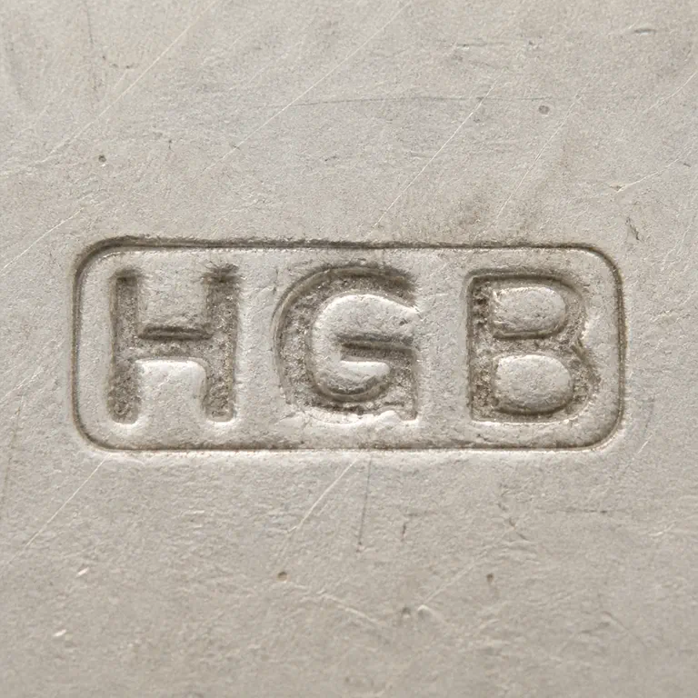 H G B: Horizontal rectangular border with H-like, G-like, and B-like forms in left-to-right order, upright and centered; oxidized reconstruction.