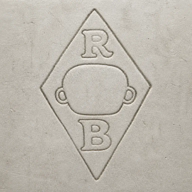 Rudolphe Beunke: A vertical diamond with R at top, B at bottom, and one broad empty rounded central form with a small loop at each side; oxidized reconstruction.