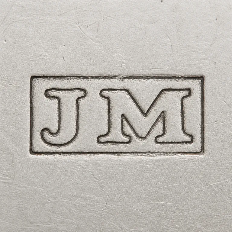 J M: J and M arranged left to right inside a simple horizontal rectangular cartouche; oxidized reconstruction.