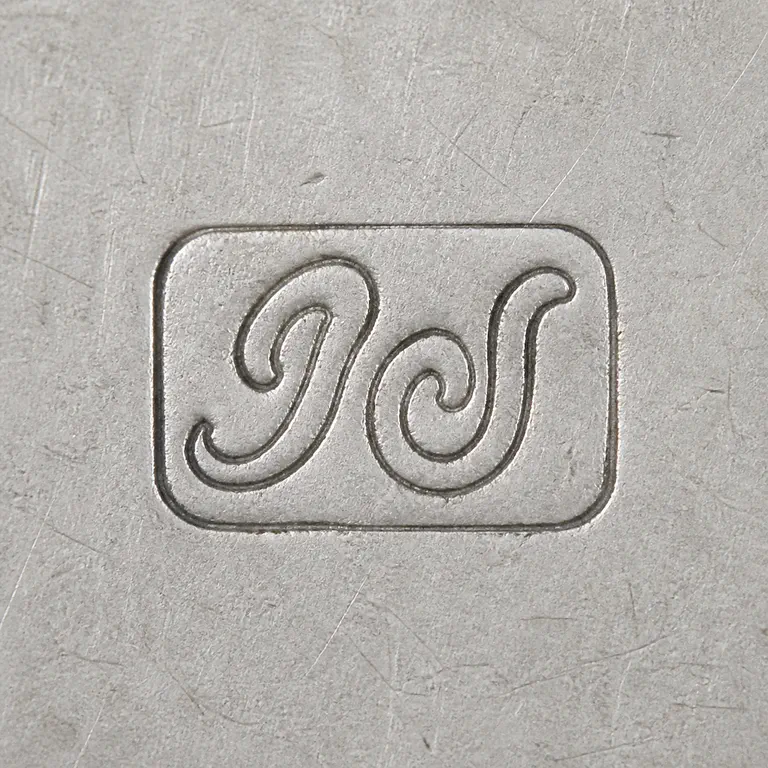 John Hugh Le Sage: Two ornate curved forms in a compact horizontal arrangement source orientation; oxidized reconstruction.
