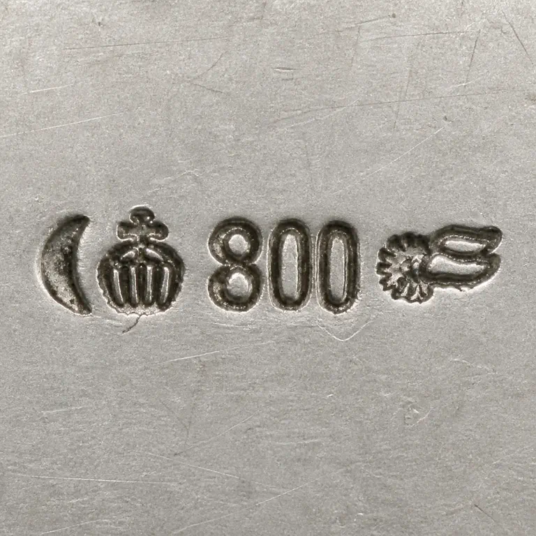 Richard Köberlin: Crescent, crown-like punch, exact 800, and compact layered wing- or coil-like terminal; oxidized reconstruction.